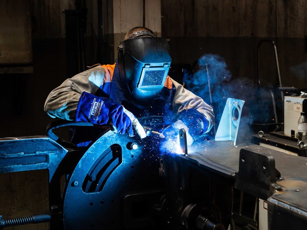 Kapos Atlas welder joining a steel component, sparks flying
